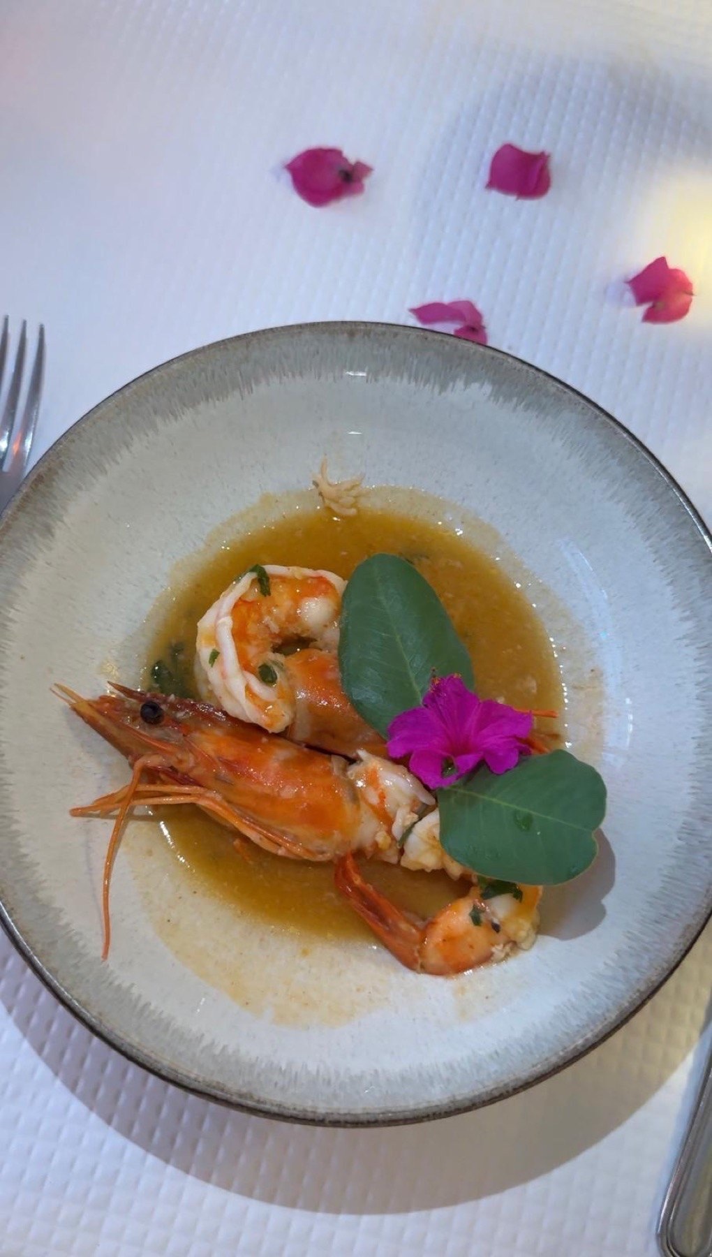 A signature prawn dish plated at Malveiro